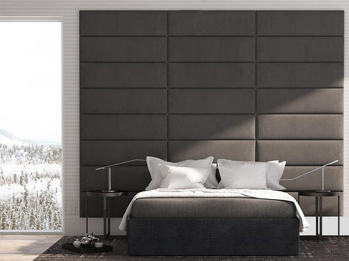 Modern bedroom interior with a large bed against textured vantpanel Panels, minimalist style furnishings, and a winter landscape visible through the window.